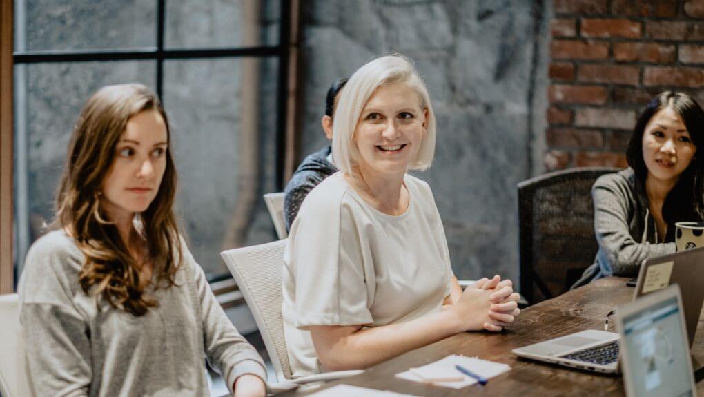 members of the Thalorix SEO Vancouver office sitting around a table